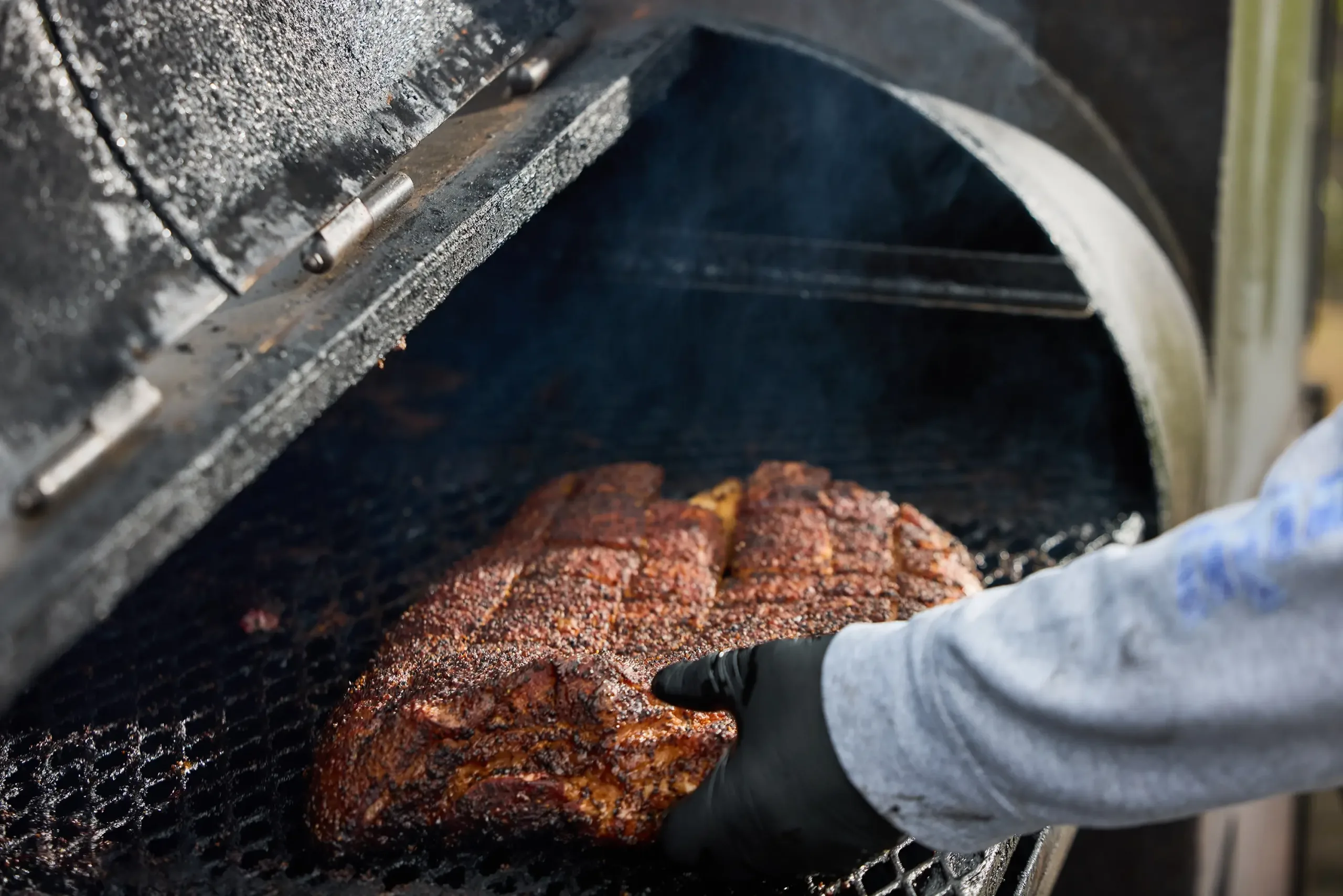 A close-up of bbq in a smoker