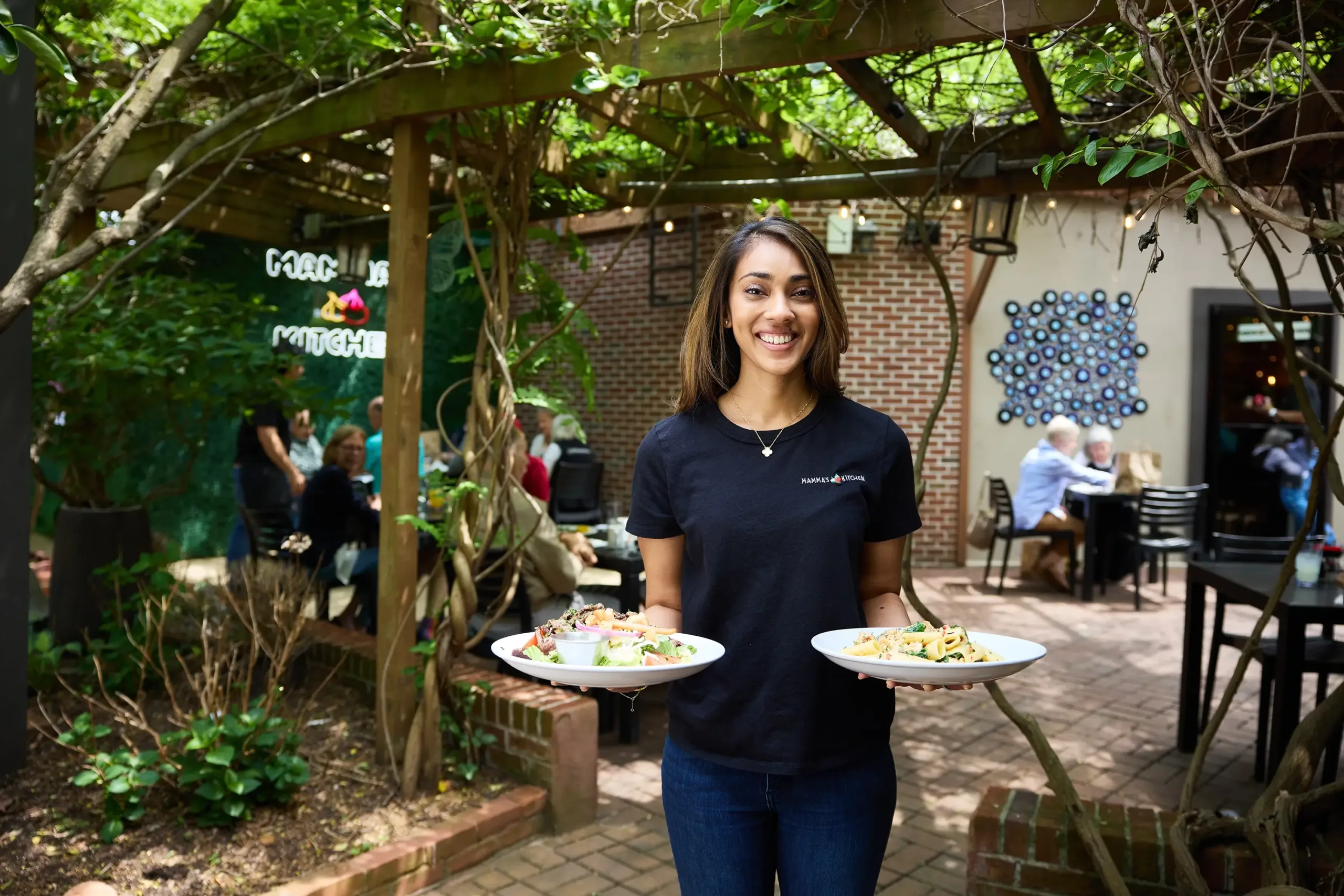 mamas-kitchen-plates-fairfax-va A woman holding plates of food