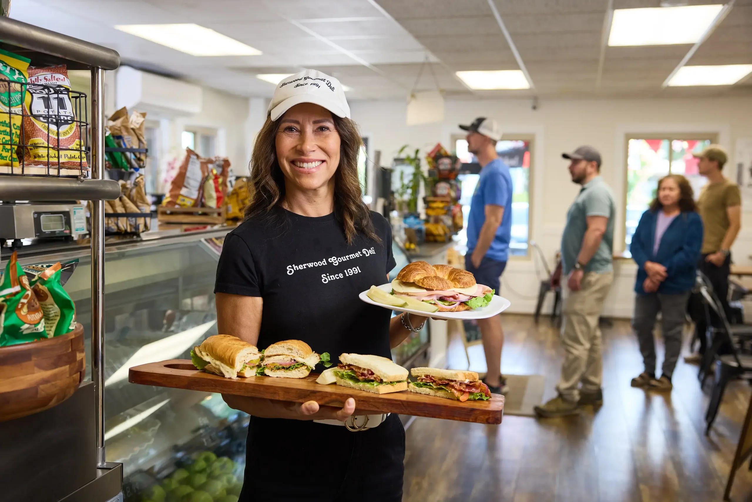 A woman hold sandwich boards